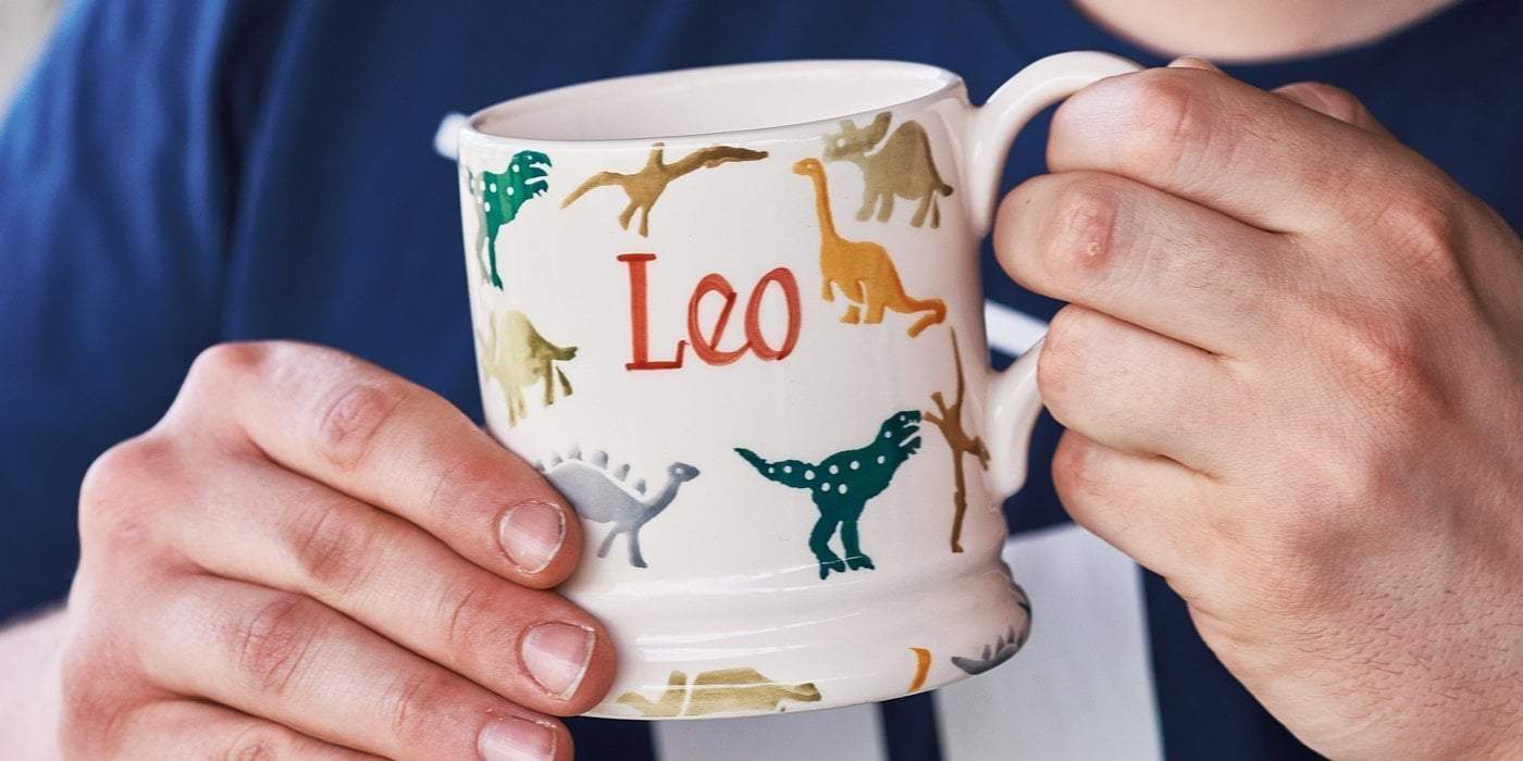 Emma Bridgewater personalised kids mugs designed with cuddly-looking dinosaurs in different types and colours, the perfect gift for loved ones.