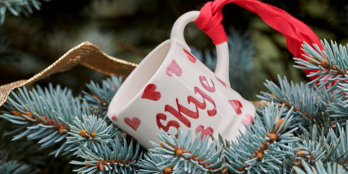 A set of 3 white ceramic personalised mugs by Emma Bridgewater, hand decorated with lovely, colourful flowers and names. Available in different sizes